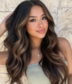 Enhance your black hair with caramel highlights for an ultimate beauty statementDiscover this curated list of captivating caramel highlights on dark and black hair for ultimate inspiration. Black Hair With Highlights, Brunette Balayage Hair