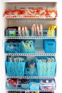 a refrigerator filled with lots of plastic containers