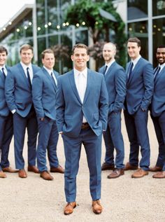 a group of men in suits standing next to each other