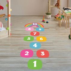 a child's room with toys and numbers on the floor in front of it