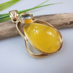 High quality gold plated milky yellow Amber. Yellow Baltic Amber. Handmade pendant  will be a stunning unique gift for her.  Weight  18,09gr Size 6 cm gold palted sterling silver 925 jewellery  With hallmarks. This item was made of natural Baltic Amber. All the amber used in my jewelry is collected in my home country Lithuania.  I sell only genuine,  real, not pressed, authentic, natural Baltic Amber. Item may have natural imperfections. Due to amber being natural, each of my jewelry is unique a