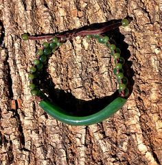 "Beautiful Canadian Jade Bracelet Large Jade piece measures 55mm wide, the jade beads are 4mm and 6mm Bracelet adjusts from 7\" to 9\" All of our jade is 100% natural nephrite jade, each bracelet is different from the next." Adjustable Aventurine Beaded Bracelets, Handmade Adjustable Jade Beaded Bracelet, Adjustable Handmade Jade Beaded Bracelet, Adjustable Handmade Jade Beaded Bracelets, Adjustable Hand Wrapped Aventurine Jewelry, Adjustable Aventurine Bracelet Jewelry, Adjustable Aventurine Bracelet, Adjustable Jade Bracelet With Round Shape, Adjustable Jade Bracelet