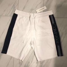 Men’s Calvin Klein Sweatshorts Price Is Firm At $45. Color: White/Black/Gray Condition: 10/10 New W Tags Sporty Calvin Klein Cotton Bottoms, Sporty White Shorts With Short Inseam, Calvin Klein Cotton Shorts For Loungewear, Calvin Klein Casual Sport Bottoms, Calvin Klein Sporty Bottoms For Sports, Calvin Klein Casual Summer Shorts, Calvin Klein Loungewear Summer Shorts, Calvin Klein Summer Loungewear Shorts, White Knee-length Shorts For Streetwear