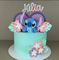 a birthday cake decorated with an image of stitchy from the disney movie lilla