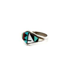 Vintage Zuni Inlay Ring, Size 6.5 - This vintage ring showcases Turquoise, Mother of Pearl, Coral and Onyx expertly inlay set. This timeless ring is Artisan Signed and marked Zuni, a perfect collectors item to add to your collection! US Ring Size: 6.5 Stone: Turquoise, MOP, Coral + Onyx Setting: .45L x .75"W Ring Band: Solid Shank Metal: Sterling Silver Weight: 2.5 Grams Stamped: 925 Marked: Zuni Artisan SIgned: DE-GM This listing is for (1) Ring only Explore our carefully curated selection of timeless Vintage Rings here. Discover the entire 'Silver Raven' Vintage Collection for yourself. Turquoise Vintage Promise Ring, Vintage Turquoise Promise Ring, Artisan Rings With Inlay For Anniversary, Modernist Turquoise Jewelry Gift, Multicolor Collectible Ring Jewelry, Modern Anniversary Rings With Inlay, Vintage Green Turquoise Ring With Inlay, Southwestern Style Rings With Inlay, Southwestern Round Rings With Inlay