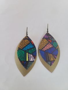 This product is a 3-inch, colorful tribal pattern on a shiny brown earring with antique gold hooks. Great for a gift! Comes from a smoke free home. Shipping is around 2-3 days, but usually ships more quickly.   Please ensure your address is correct before purchasing. We will ship to the address provided at checkout and we are not responsible for products shipped to the wrong address. Thank you! Artsy Brown Earrings With Ear Wire, Brown Dangle Earrings With Artsy Style, Artsy Multicolor Nickel Free Earrings, Nickel-free Multicolor Artsy Earrings, Artsy Multicolor Nickel-free Earrings, Artsy Brown Drop Earrings, Brown Artsy Earrings, Hand Painted Multicolor Earrings For Party, Multicolor Hand Painted Drop Earrings