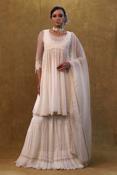 Off white anarkali with sequin and thread embroidery, embellished with pearl work and a back tasseled tie-up. Paired with a skirt and dupatta. - Aza Fashions Off White Anarkali, Kurta Skirt, White Anarkali, Pearl Work, Work Skirt, White Kurta, Work Skirts, Thread Embroidery, Skirt Pattern