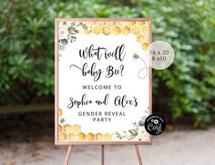 a welcome sign for a baby shower with honeycombs and greenery on it