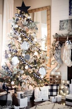 a decorated christmas tree with black and white ornaments