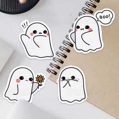 four stickers depicting ghost faces with flowers