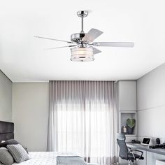 a bed room with a neatly made bed and a ceiling fan in the middle of it