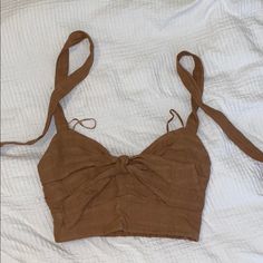 Brown Crop Top With Tie Straps New Spring Beach Crop Top With Knotted Straps, Summer Crop Top With Knotted Straps, Cotton Crop Top With Tie Straps For Vacation, Cotton Top With Knotted Straps For Summer, Chic Summer Crop Top With Knotted Straps, Spring Crop Top With Knotted Straps, Summer Crop Top With Knotted Straps For Day Out, Brown Cotton Summer Tank Top, Brown Cotton Tank Top For Summer