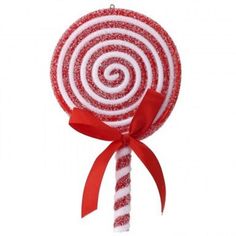 a red and white lollipop with a bow on it