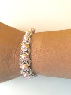 Adjustable Pink Beaded Bracelet With Silver Beads, Handmade Pink Crystal Bracelet For Wedding, Adjustable Pink Pearl Bracelet With Spacer Beads, Handmade Pink Pearl Bracelet, Adjustable Pink Jewelry With Silver Beads, Pink Adjustable Pearl Stretch Bracelet, Adjustable Pink Pearl Stretch Bracelet, Pink Beaded Pearl Bracelet For Wedding, Elegant Handmade Pink Stretch Bracelet