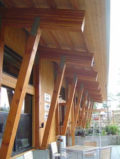 an outdoor seating area with chairs and tables