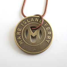 "A unique necklace that I made with an original vintage Vallejo, CA \"MARE ISLAND FERRY\" transit token (this token was first used in 1953). The coin is solid bronze and larger at 7/8\" in diameter. The chain is an antiqued bronze / copper tone with lobster claw clasp and you can choose 18\" or 20\" length. It will come in a new gift box and this is the exact piece you will receive. Please let me know if you need more than one. I also have a key chain version in my shop: www.etsy.com/listing/895 Vintage Personalized Jewelry For Collectors, Vintage Brass Necklace With Coin Pendant, Vintage Coin Necklaces, Vintage Collectible Coin Pendant Jewelry, Collectible Vintage Jewelry With Coin Pendant, Vintage Coin-shaped Brass Necklaces, Vintage Collectible Jewelry With Coin Pendant, Vintage Brass Coin Necklaces, Vintage Bronze Necklace With Coin Pendant