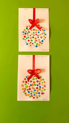 two cards with different designs on them, one has a red ribbon and the other has a green background