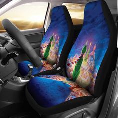 the interior of a car with two seats covered in blue and orange designs, including an image of a woman holding a flower