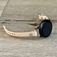 10mm Off-White Color Genuine Leather Strap Band Compatible with: Galaxy Watch 5 (40mm & 44mm) | Galaxy Watch 5 Pro (46mm) Galaxy Watch 6 (40mm & 44mm) | Galaxy Watch 6 Classic (43mm & 47mm) Adjustable Size Bracelet Perfectly Tailored to Fit Your Wrist.  Designed And Handmade by Simeon D Jewelry.  The Bracelet Can be Made Also with Gold Hardware by Request! Super Easy to Install on Your Watch - Comes with 4pcs  20mm Quick Release Pins.  Not For Other Models. Samsung Galaxy Watch Is NOT Included. White Watch With Leather Strap For Everyday, White Leather Strap Watch For Everyday Use, Modern White Leather Strap Apple Watch Band, Modern White Leather Apple Watch Band, Everyday Watch Band With Stainless Steel Clasp, Adjustable White Apple Watch Band For Everyday, Modern White Apple Watch Band For Everyday Use, White Adjustable Watch Accessories For Everyday Use, White Watch Bands With Bracelet Strap