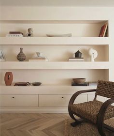 a chair and some shelves in a room