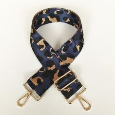 "Beautiful blue leopard handbag strap.  This strap is made of high quality woven material with gold hardware.  Update and add versatility to your handbag collection with this trendy and fun accessory. Width:  2 inches wide Adjustable Length:  31\"-52\" in length. SHIPPING 1-2 business days for shipping / 3-5 business days for delivery DISCLOSURE There may be a slight difference in color due to the variation in individual monitor settings." Guitar Strap Purse, Leopard Handbag, Black Gift Bags, Adjustable Bag Strap, Blue Keychain, Leopard Bag, Mothers Bag, Purple Gift, Handbag Outfit