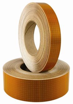 two rolls of tape are stacked on top of each other