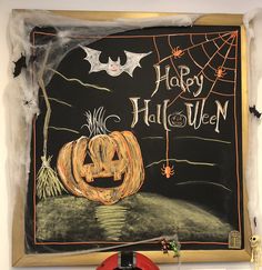 a chalk board with a jack - o - lantern on it