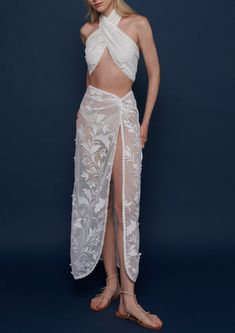 Every WAIMARI piece has a story. Started by two Colombian sisters, the brand is passionate about what goes into their resort wear, embracing the traditions of the local craftspeople they employ and focusing on both the sustainability and quality of their investment pieces. The Sirena Skirt in White is a front knot tulle maxi in a sheer floral applique fabric. We love it as a cover-up, or as an elegant look on a walk through town. Product Details 100% polyester. Trim: 100% polyester. Care Instruc Luxury Beachwear, Applique Skirt, Pool Party Outfits, Luxury Resort Wear, Sarong Skirt, Tulle Maxi Skirt, Beaded Skirt, Beach Skirt, Applique Fabric