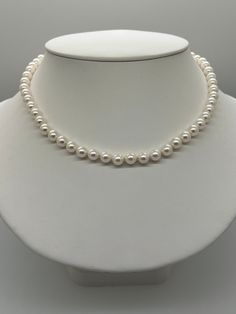 White Akoya Pearl Necklace.   This hand knotted strand features 56 White Japanese Akoya Pearls AAA High Luster Round rose overtones 7-7.5mm.  I hand knotted these with white silk thread and finished them with a 14K Yellow Gold round corrugated bead clasp 7mm.  The necklace measures 17 3/4 inches in length.  These are Genuine Pearls and natural in color.   This is a beautiful strand of classic pearls that can be worn for any occasion.  The necklace pictured is the one you will receive.  This necklace will arrive in a nice presentation box with a Certificate of Authenticity.  Please visit our shop for more pearls and gemstone jewelry. Japanese Pearls, Akoya Pearl Necklace, Corpus Christi Tx, Akoya Pearls, White Silk, Silk Thread, Piercing Jewelry, Pearl White, Gemstone Jewelry