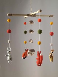 a mobile with animals hanging from it's sides