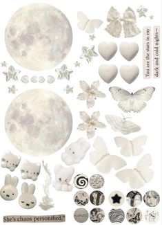 an assortment of white paper cut outs with butterflies, hearts, and stars on them