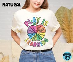 Play Is Learning Teacher Back To School Shirt Daycare Teacher Preschool Prek Kindergarten Tee First Day Of School Teacher Appreciation Gift ↓ See the rest of our trendy collections here ↓ https://www.etsy.com/shop/tranhuynhduc Product Details: 100% Cotton (fiber content may vary for different colors) Medium fabric (5.3 oz/yd² (180 g/m Classic fit Tear away label Runs true to size Care instructions: Machine wash: warm (max 40C or 105F); Non-chlorine: bleach as needed; Tumble dry: medium; Do not i Pre K Teacher Shirts, Daycare Teacher Shirts, Teacher Preschool, First Day Of School Teacher, Teacher Fits, Prek Teacher, Preschool Teacher Shirts, Education Shirts, Preschool Shirts