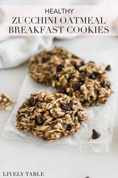 healthy zucchini oatmeal breakfast cookies on parchment paper with chocolate chips