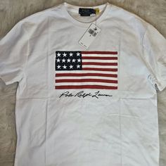 Brand New, Never Worn, With Tags, Polo By Ralph Lauren Graphic Tee Casual White Shirt With American Flag Print, White Shirt With Flag Print For Spring, White Casual Shirt With Flag Print, Casual White Shirt With Flag Print, Casual White Flag Print Top, Casual Long Sleeve T-shirt With Flag Print, Spring White Shirt With Flag Print, Casual White Top With Flag Print, White Cotton Shirt With American Flag Print