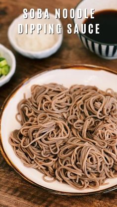 there is noodle soup in the bowl on the table