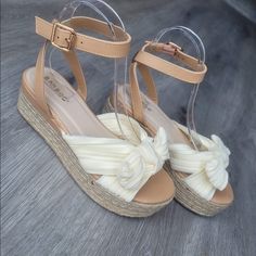 Beige/Cream Sandal With Satin Feel Bow Across Top Bamboo Brand Infinity Style. P/U Ankle Strap With Soft Fabric Bow Strap Across Foot. Perfect Sandals To Wear To All Your Spring Time Functions. Extremely Comfortable Sandal That’s Easily Wearable For All Ages. Tts Approx 1” Height Platform New In Box Beige Wedge Sandals, Cream Sandals, Beige Wedges, Fabric Bows, Comfortable Sandals, Wedge Sandal, Womens Shoes Wedges, Wedge Shoes, Spring Time