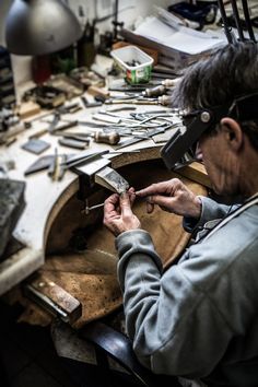 a man is working on something in his workshop