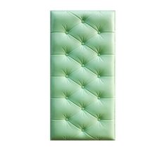 a green upholstered headboard with buttons on it