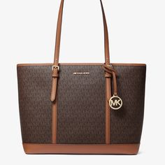 Nwt Michael Kors Jet Set Travel Large Logo Tote Bag Details Tote Bag Logo-Print Canvas 89.4% Coated Canvas/9.6% Polyester/1% Polyurethane Gold-Tone Hardware 17”W X 11.5”H X 6.25”D Handle Drop: 11” Interior Details: Back Zip Pocket, 2 Front Slip Pockets Lining: 100% Polyester Zip Fastening Brown Tote Shoulder Bag With Logo, Brown Logo Tote Shoulder Bag, Logo Tote Bag In Signature Coated Canvas, Classic Double Handle Bag In Signature Coated Canvas, Classic Double Handle Bag In Coated Canvas, Brown Double Handle Shoulder Bag With Logo, Classic Brown Signature Coated Canvas Bag, Classic Bags With Branded Hardware In Coated Canvas, Classic Coated Canvas Bags With Gold-tone Hardware