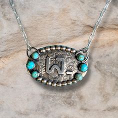 Show your cowgirl spirit in style with this Custom Oval Brand Necklace! This stylish accessory features an oval brand pendant with a stunning turquoise and textured background. Giddy up to the most eye-catching necklace in town! Features: This custom Oval Brand Necklace is made with solid sterling silver Kingman turquoise stones of multiple sizes. It measures 1.5 in. x 1 in. and makes a timeless addition to any jewelry collection. See Options for more details. Western Jewelry Cheekys Boutique, Luxury Turquoise Necklace With Oval Pendant, Western Turquoise Necklace, Luxury Southwestern Oval Necklace, Silver Smithing Jewelry, Western Shopping, Western Jewelry Necklace, Turquoise Wedding Jewelry, Real Turquoise Jewelry