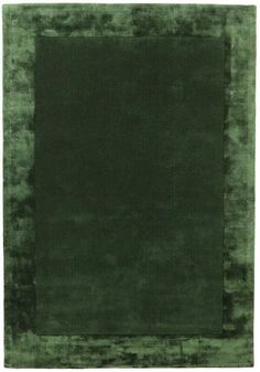 a green area rug with a square in the middle