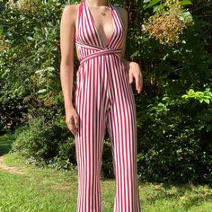 Stop People In Their Tracks With This Pinstripe Jumpsuit The Material Is Very Stretchy And Crazy Flattering! The Pants Are Long (I Am 5’5 For Reference) So Wearing Heels Or Pumps Are A Must! The Jumpsuit Is So Fun And Flirty And Perfect To Rock For College Game Days This Is Such A Favorite And I Need To Find Her The Perfect Home:) Measurements - 115 Cm From Waist To Bottom -Size S But Fits Xs And S Very Well I Only Wore It Once And Looks Brand New! No Stains, No Tears, No Pilling!! Striped V-neck Jumpsuits And Rompers For Summer, Chic Fitted Jumpsuits And Rompers With Vertical Stripes, Fitted Jumpsuits And Rompers With Vertical Stripes, Striped Overalls Jumpsuits For Spring, Spring Striped Overall Jumpsuits And Rompers, Striped Jumpsuits For Spring Day Out, Striped Fitted V-neck Jumpsuit, Striped Fitted Jumpsuits And Rompers For Day Out, Striped Fitted V-neck Jumpsuits And Rompers