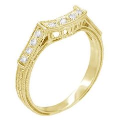 a yellow gold ring with diamonds on it