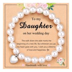 a bracelet that says to my daughter on her wedding day with pearls and flowers around it