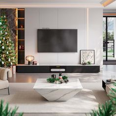 a living room with white furniture and christmas trees in the corner, along with a flat screen tv