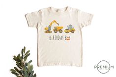 a t - shirt that says birthday boy with construction trucks on the front and back