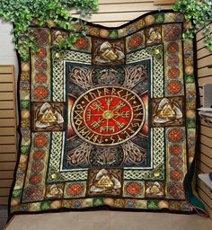 a blanket with an image of a clock on the front and back side, surrounded by plants