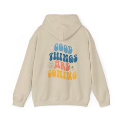 We produce the best quality designs for you like Good Things Are Coming Hoodie. Enjoy comfort and elegance.  Size: If you like a comfortable fit, you can increase your size selection by one size. If you're slim cut lover, please please make one size smaller. Wash Care Instruction: Please wash the product with cold water and turn inside out. Please do not dry at high temperature. Do not apply high pressure to the printing part while ironing on the product. If possible, iron the printing part on the baking sheet. Do not dry clean. A unisex heavy blend hooded sweatshirt is relaxation itself. The material is a thick blend of cotton and polyester. This makes for a plush, soft feel alongside warmth. It's also a great surface for printing. There are no side seams. A spacious kangaroo pocket hangs Comfortable Long Sleeve Hoodie With Letter Print, Comfortable Fleece Hoodie With Letter Print, Comfortable Hooded Sweatshirt With Letter Print, Cotton Hooded Sweatshirt With Slogan, Trendy Graphic Print Fleece Hoodie, Trendy Fleece Hoodie With Graphic Print, Long Sleeve Cotton Hoodie With Slogan, Cotton Long Sleeve Hoodie With Slogan, Winter Hoodie With Slogan For Loungewear