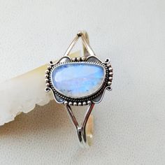 925 Sterling Silver Handmade Cuff Bracelet Gemstone - Blue Flashy Rainbow Moonstone Stone Shape - Fancy Colour - White Colour with Blue/Rainbow Fire Cut - Plain Cabochon Gemstone Size - 27*17 mm QTY - 1 piece. # Please send us your message in conversation if you have any questions or need more quantity of any particular item . Bohemian Silver Moonstone Cuff Bracelet, Silver Moonstone Bangle, Bohemian Sterling Silver Bangle With Gemstone, Adjustable Silver Moonstone Jewelry, Adjustable Moonstone Jewelry For Formal Occasions, Moonstone Gemstone Cuff Bracelet Bangle, Adjustable Sterling Silver Cuff Bracelet With Cabochon, Adjustable Sterling Silver Cabochon Cuff Bracelet, Adjustable Cabochon Sterling Silver Cuff Bracelet