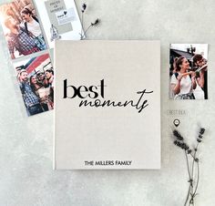 the best moments book is laying next to some photos